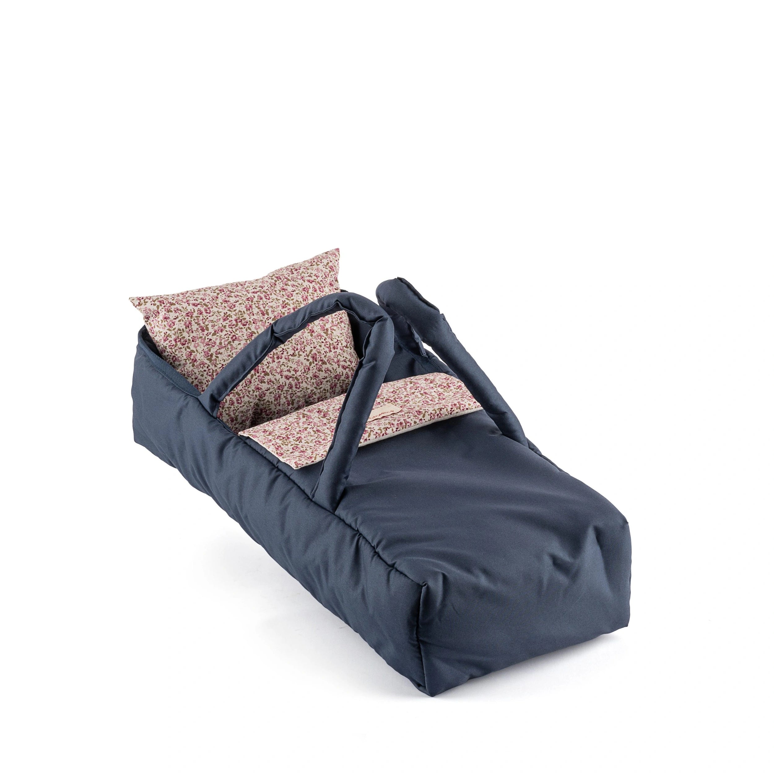 Navy doll carrycot with floral-patterned pillow and sheet, designed for dolls 36-46 cm.