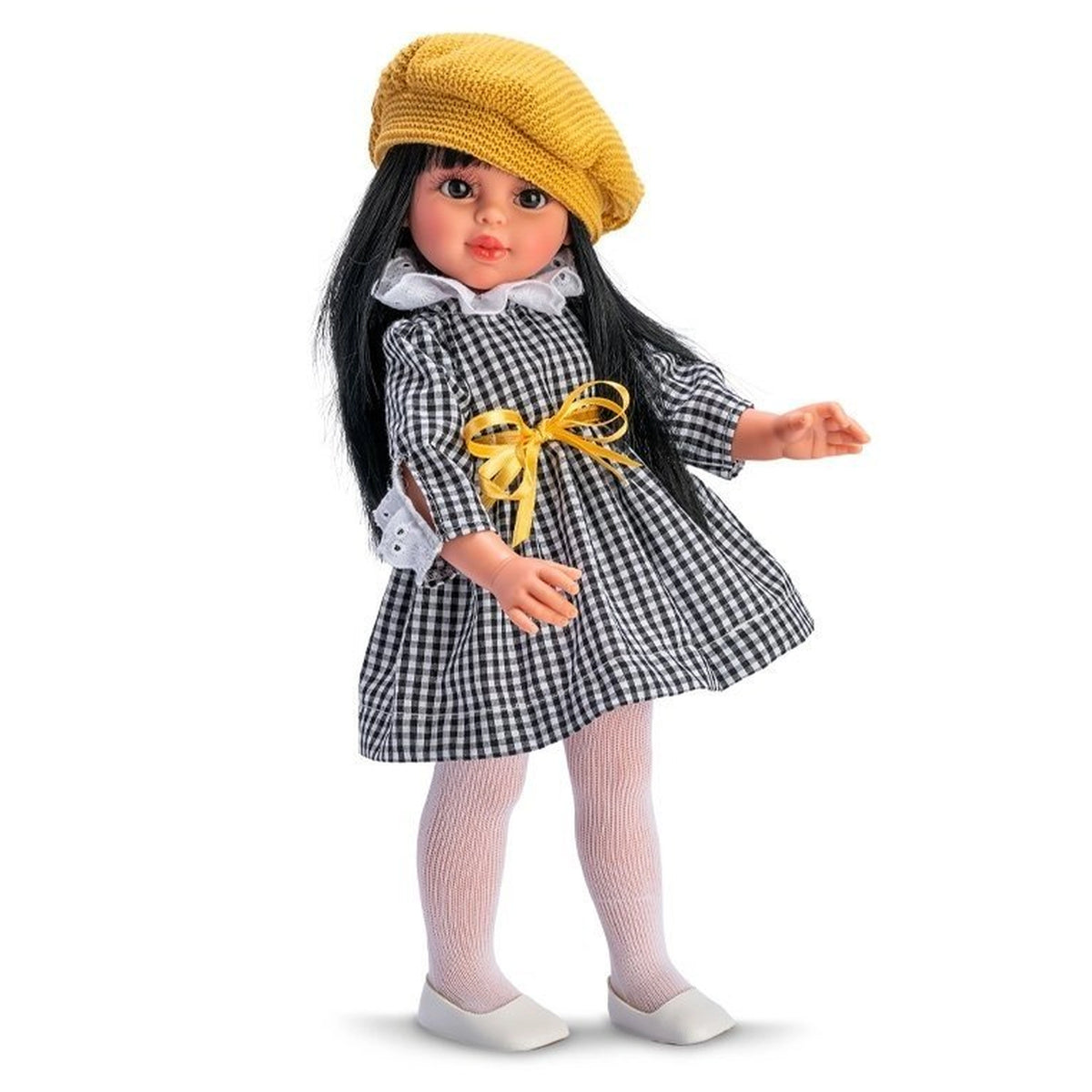 Doll in a black vichy dress with a yellow beret and white tights, standing with a cheerful pose.