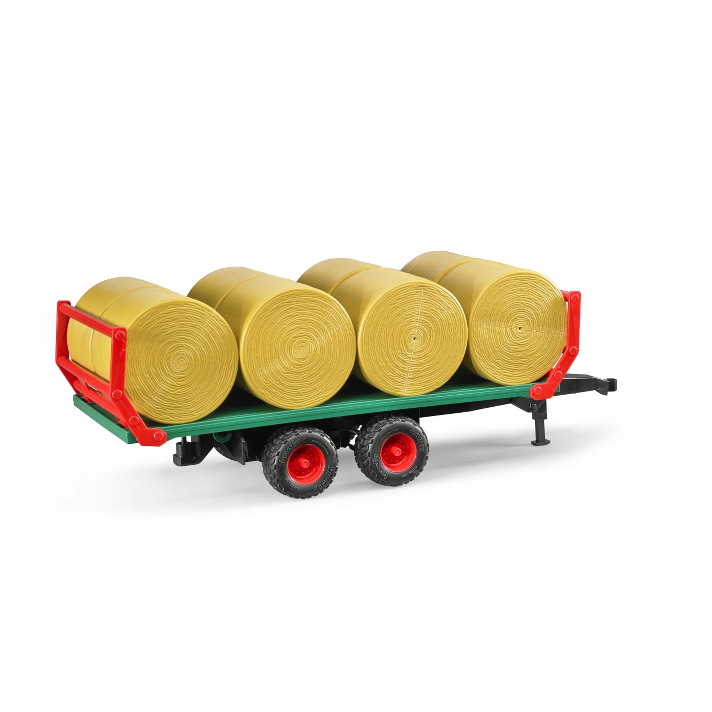 Green toy trailer with eight yellow round bales, featuring red accents and realistic black wheels.