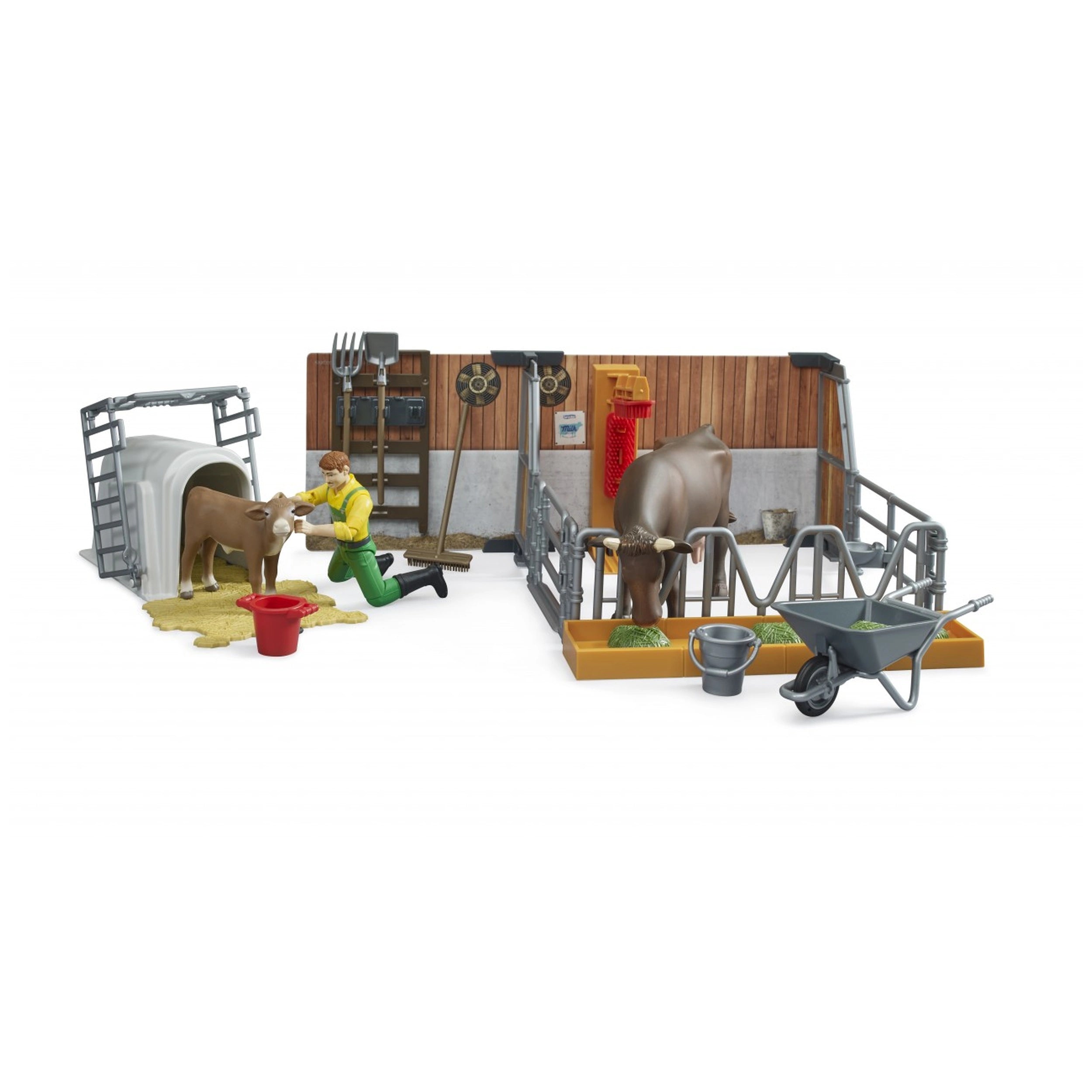 Farmer tending calf in barn set with cow, feed trough, red bucket, and wheelbarrow from Bruder's Bworld collection.