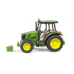 Green and yellow John Deere 5115 M toy tractor with detailed engine block on display, side view.