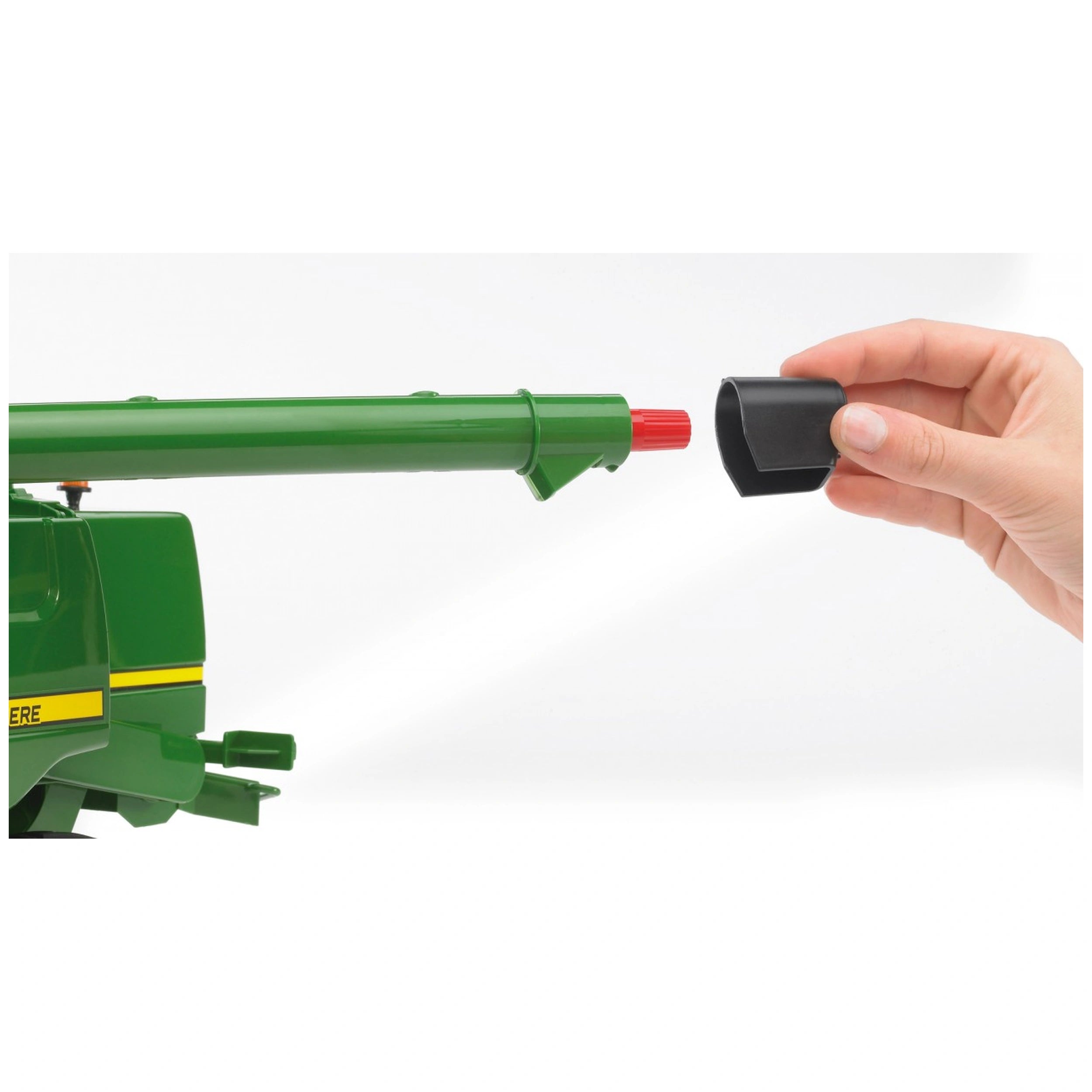 Green John Deere combine harvester model with removable black cap, showcasing functional drain tube detail.