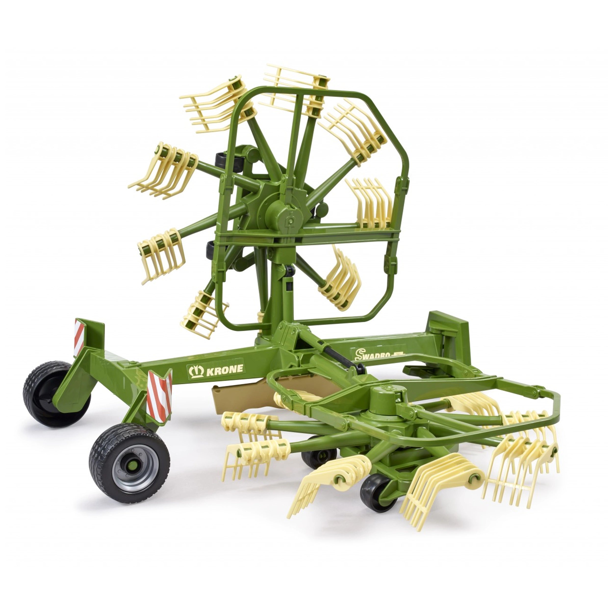 Green Bruder Krone toy swather with dual rotary design, featuring beige prong arms and realistic farm machinery details.