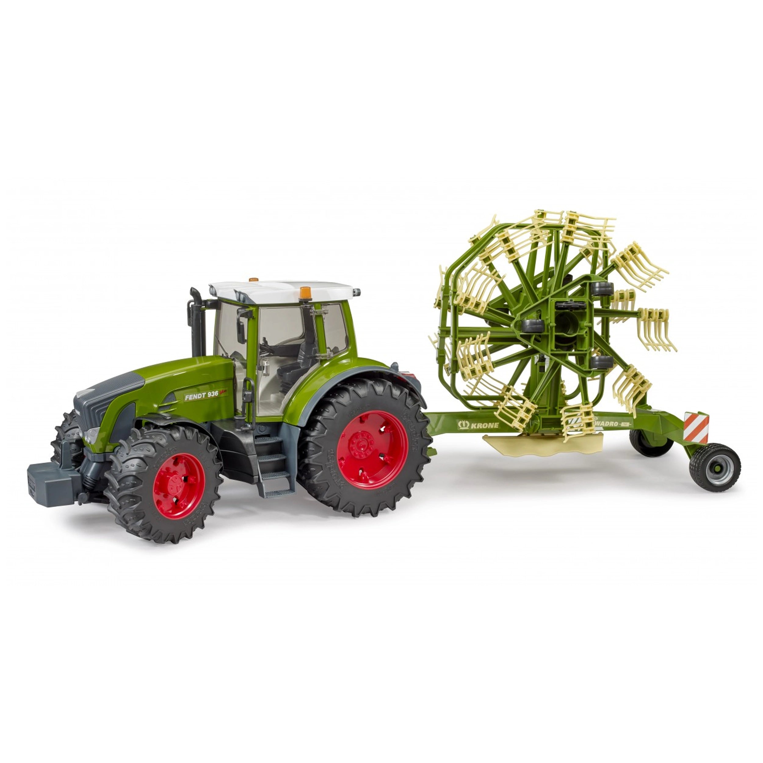 Green toy tractor with red wheels attached to a green rotary swath windrower, featuring multiple prong arms.