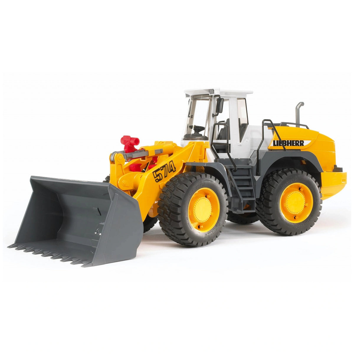 Yellow Bruder Liebherr L574 articulated road loader toy with a large grey front shovel and realistic detailing.