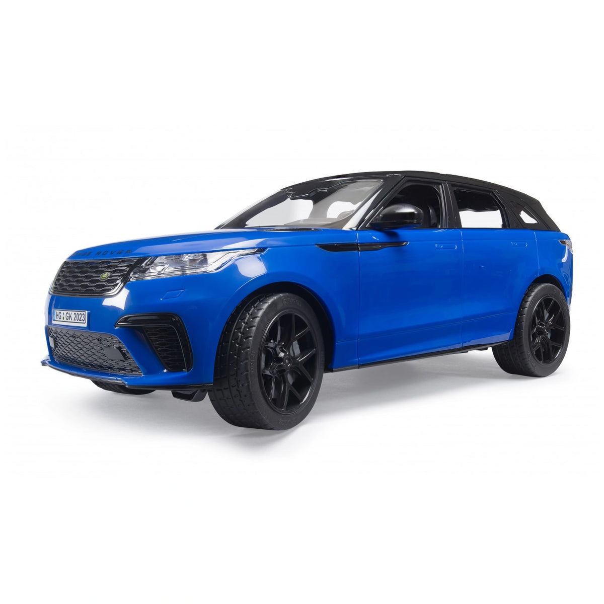 Blue Bruder Range Rover Velar toy car with black wheels, angled view highlighting sleek design and detailed features.