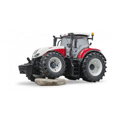 Bruder Steyr 6300 Terrus CVT toy tractor with detailed cabin and large tires on a white background.