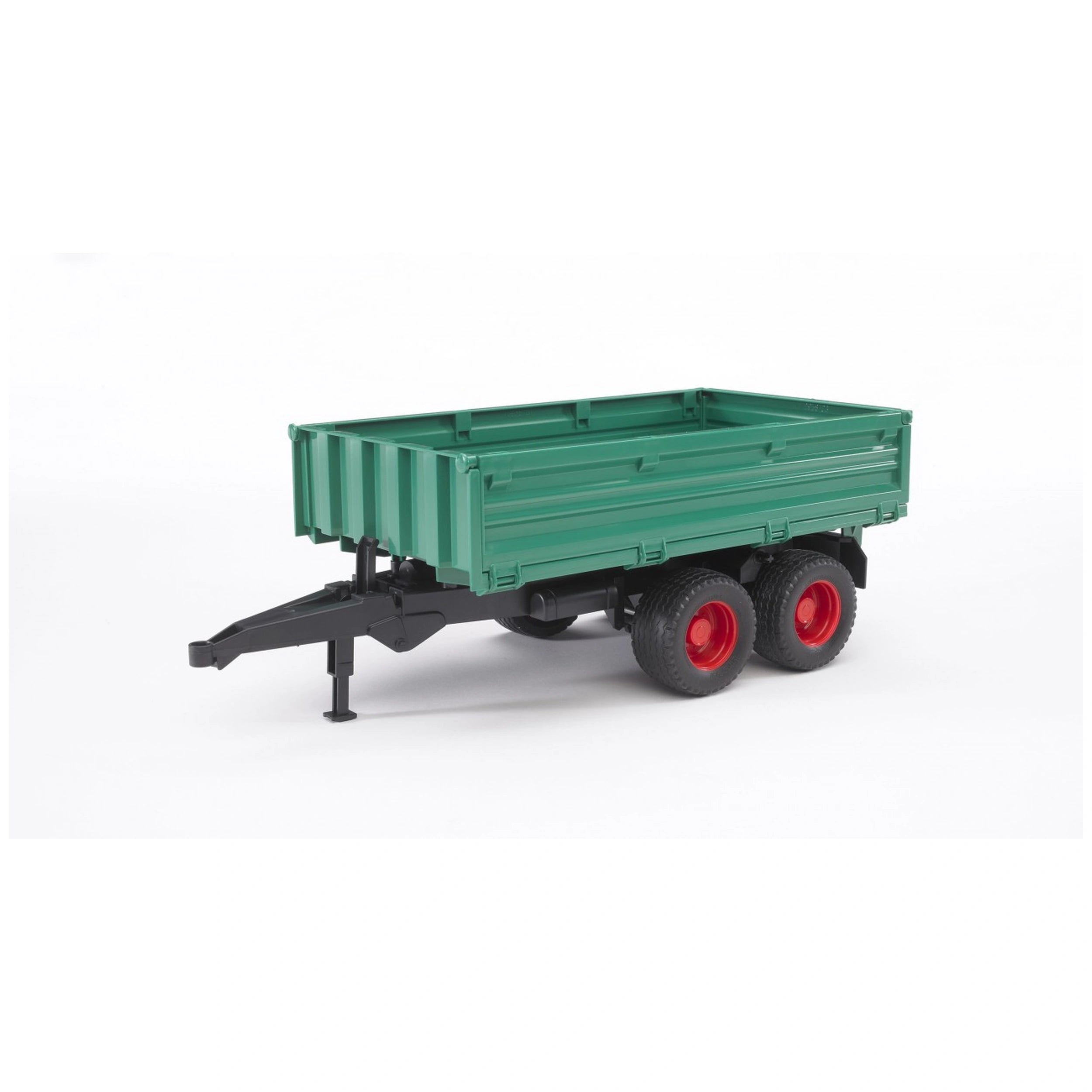 Green tandem-axle tipping trailer with red wheels on a white background.