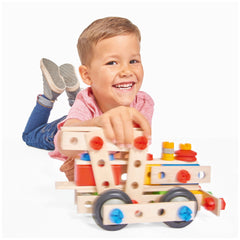 Eichhorn Constructor 4 in 1 construction set features colorful wooden train tracks and carriages, played with by a young chil