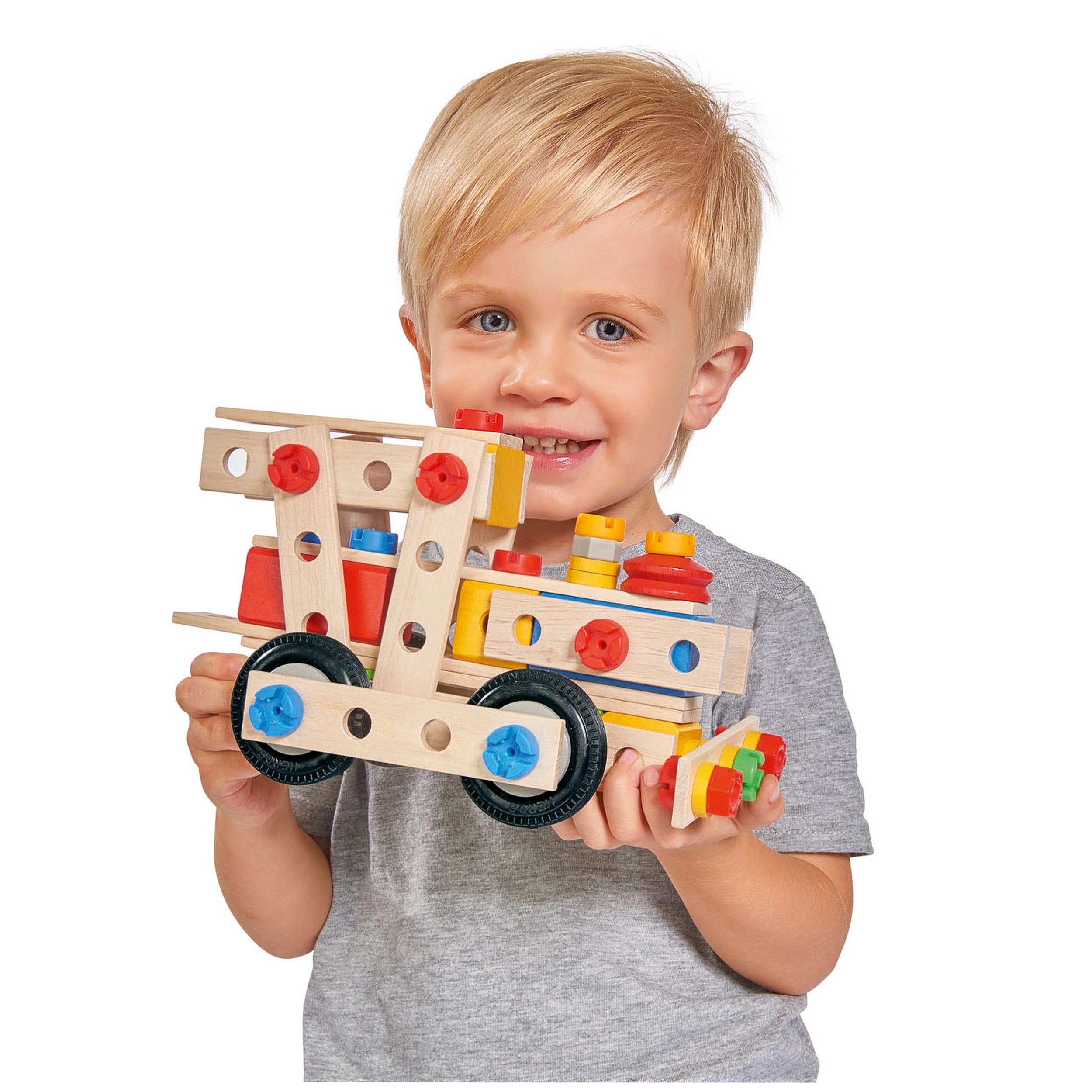Eichhorn Constructor 4 in 1 construction set features a gray wooden toy truck with red wheels and colorful plastic connectors