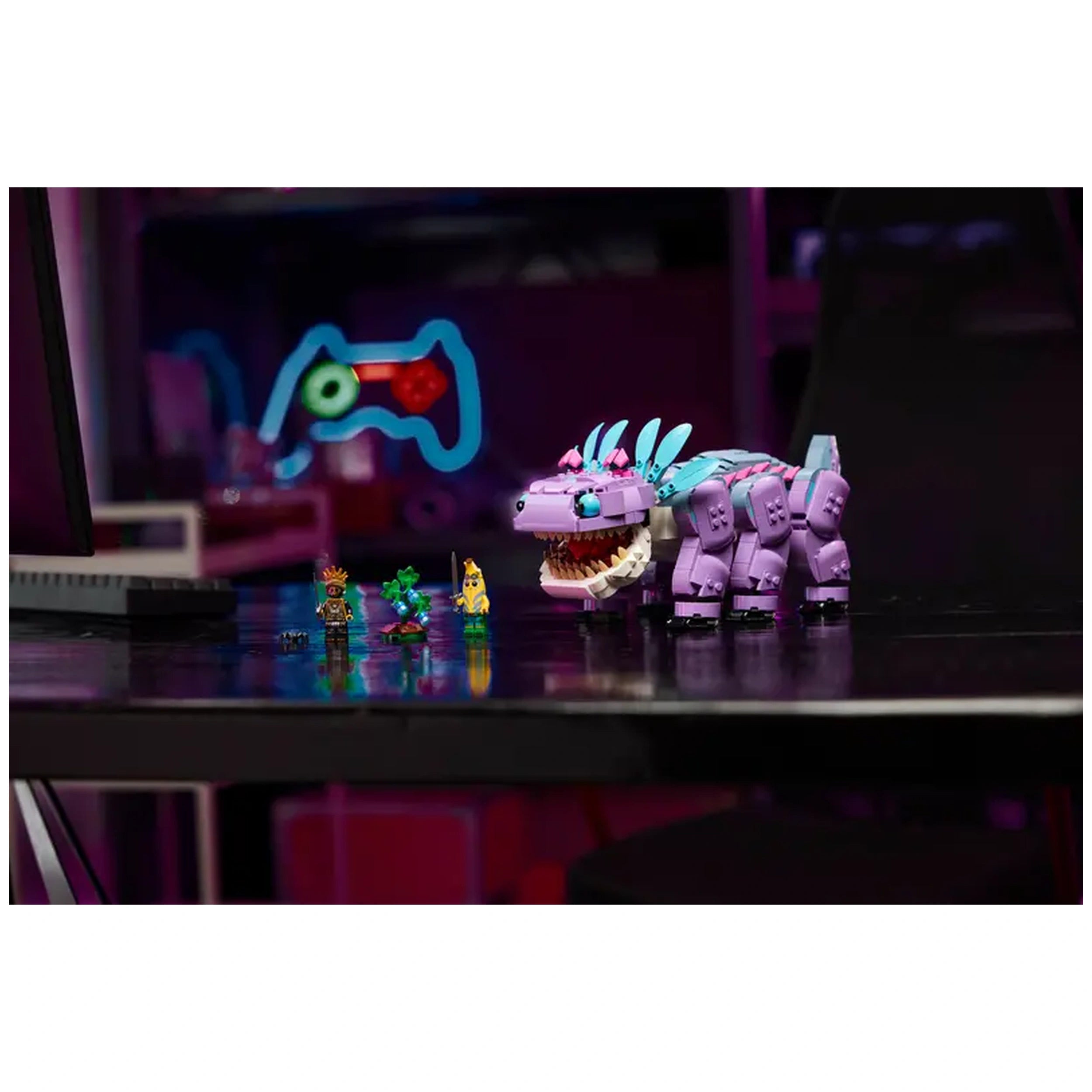 LEGO Fortnite Klombo construction set with a purple creature, featuring movable legs and an opening mouth, alongside two minifigures.
