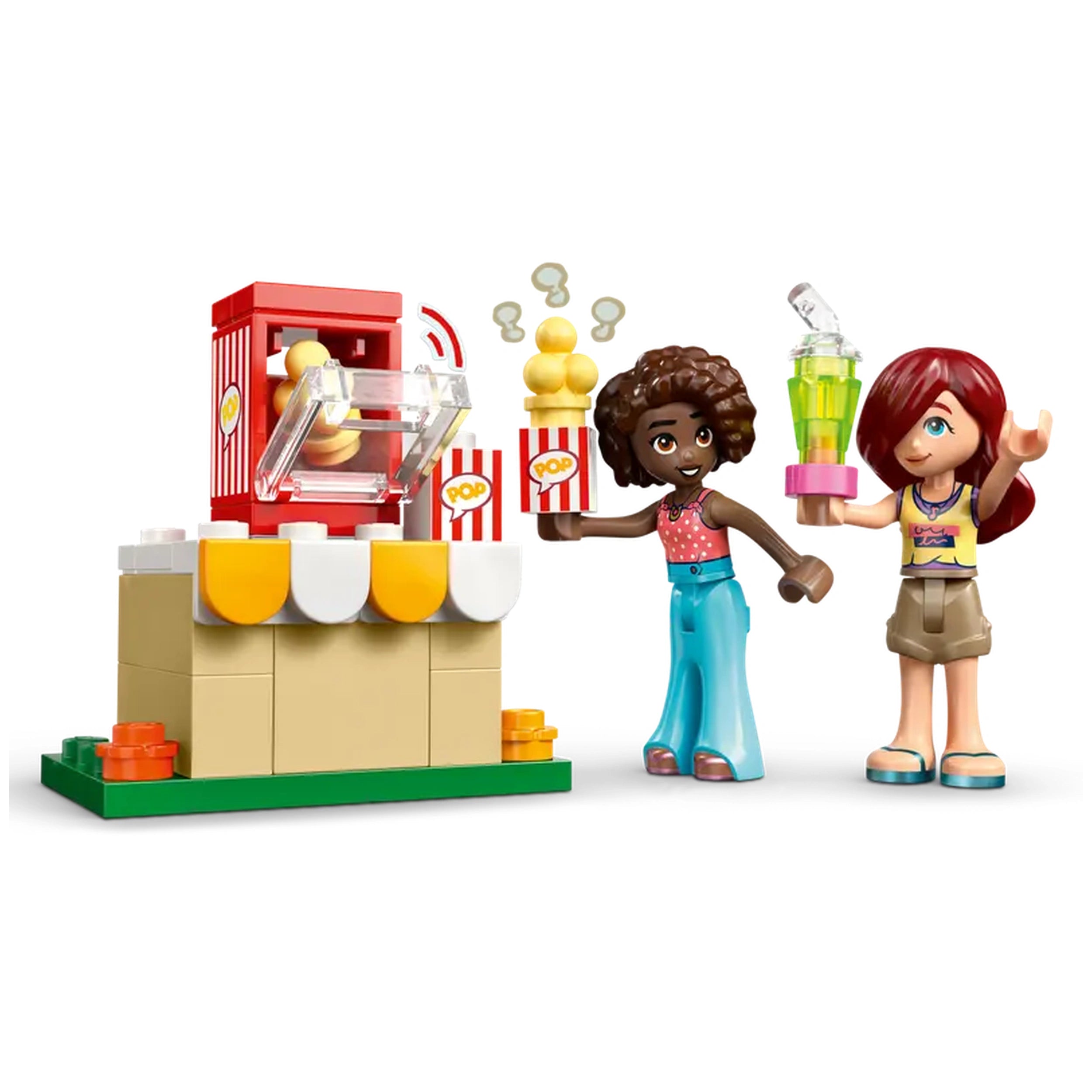 Two LEGO Friends minidolls, one holding popcorn and the other a drink, stand beside a popcorn machine with movie-themed accessories.