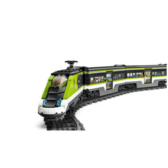 LEGO City Express Passenger Train set, featuring a sleek green and white bullet locomotive, curved tracks, and a passenger car with windows.