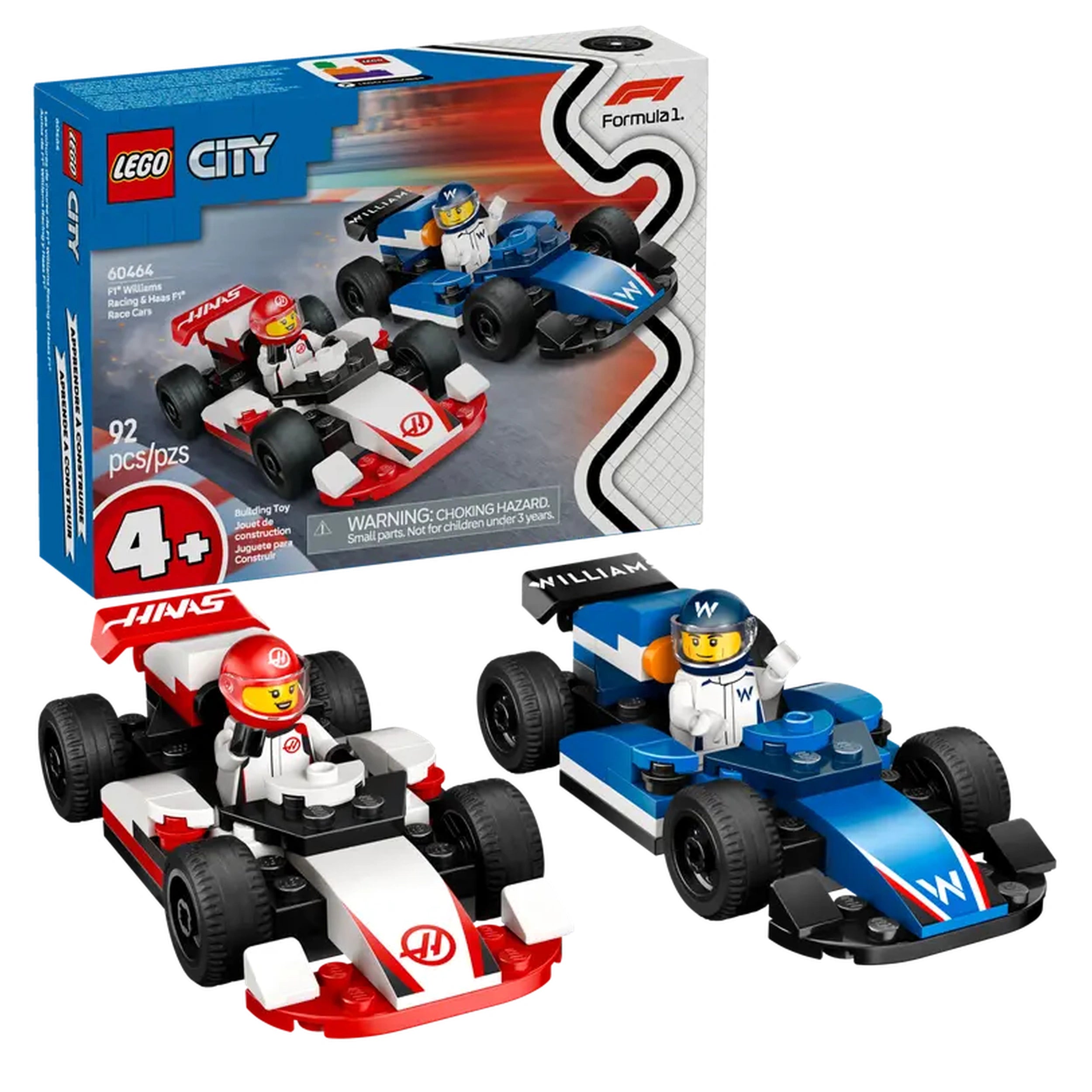 Two LEGO® F1® race cars side by side: a white and red Haas car with a red driver and a blue Williams car with a blue driver, both in front of their colorful packaging.