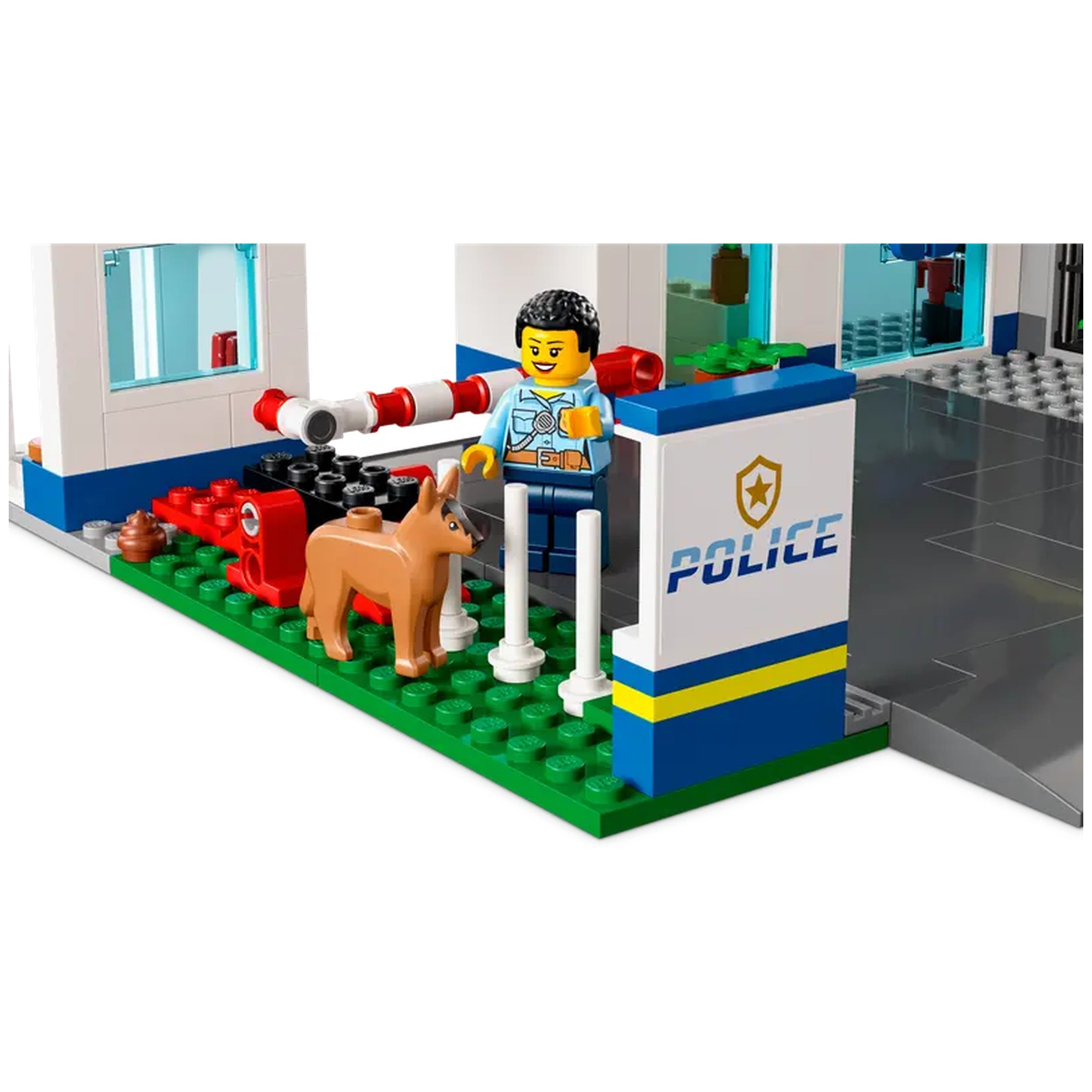 LEGO® City Police Station features a police officer standing next to a friendly dog, with the police station backdrop showcasing detailed elements.