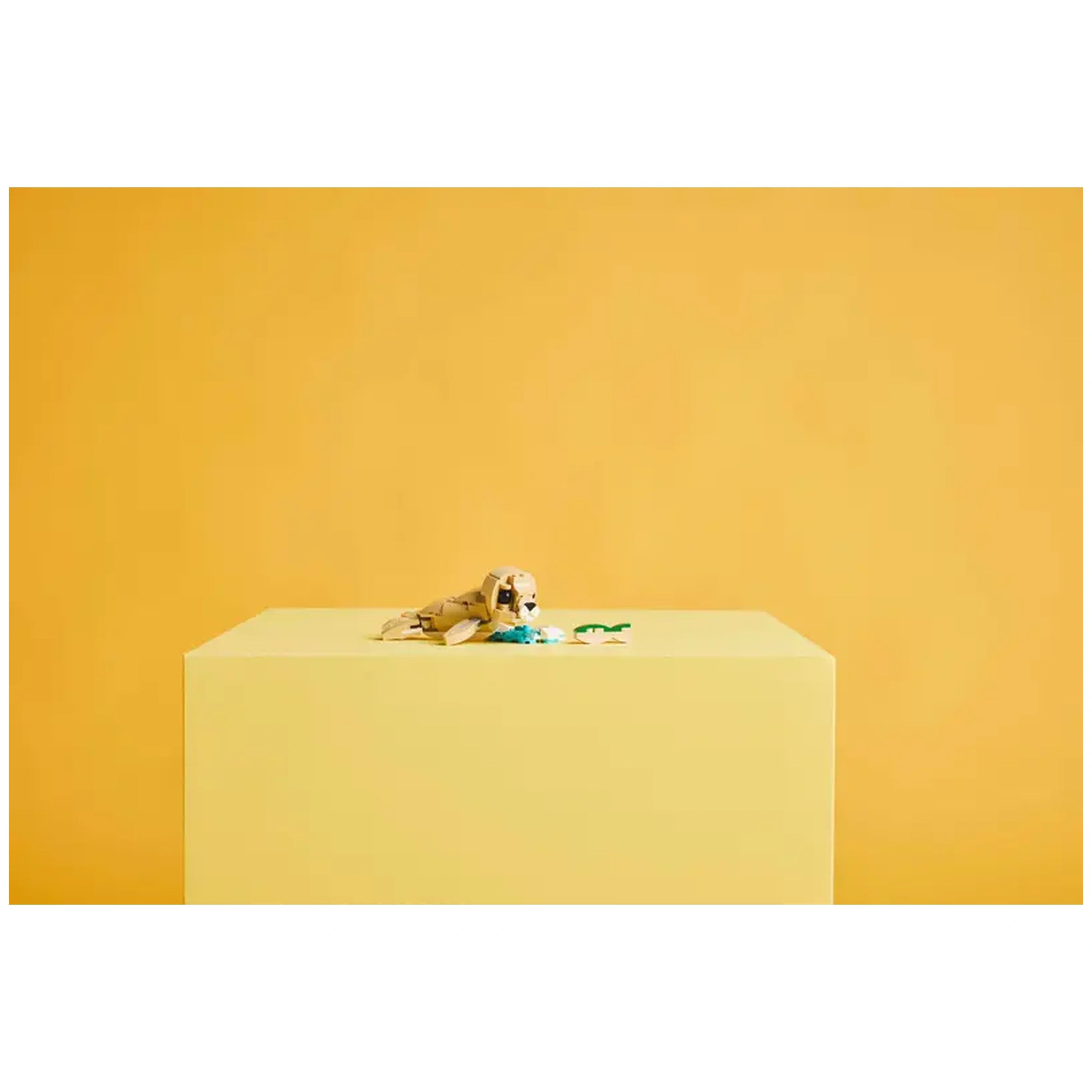 Cute LEGO Creator 3in1 Bunny building set on a yellow pedestal, featuring a posable bunny with a sunflower and a carrot.
