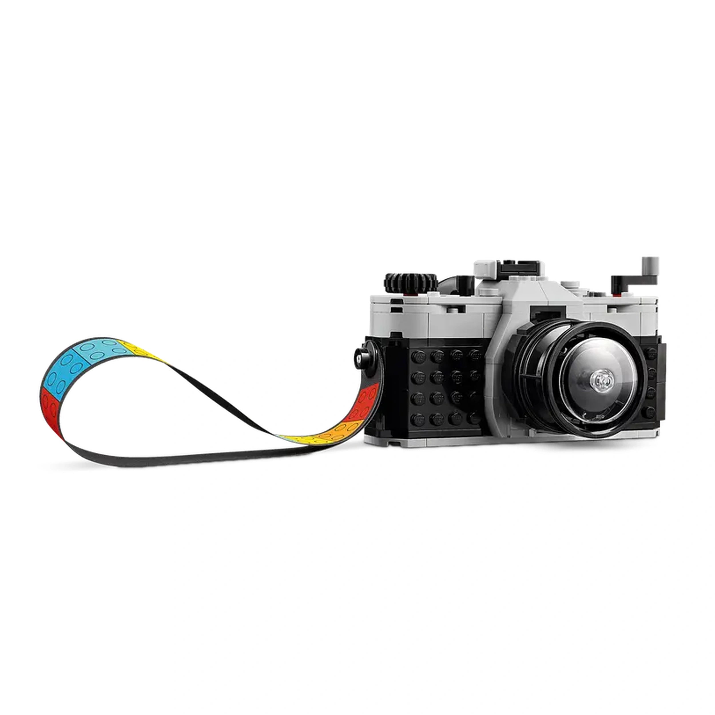 LEGO® Creator Retro Camera toy in gray and black with a moving lens and a colorful, patterned film strip attached.