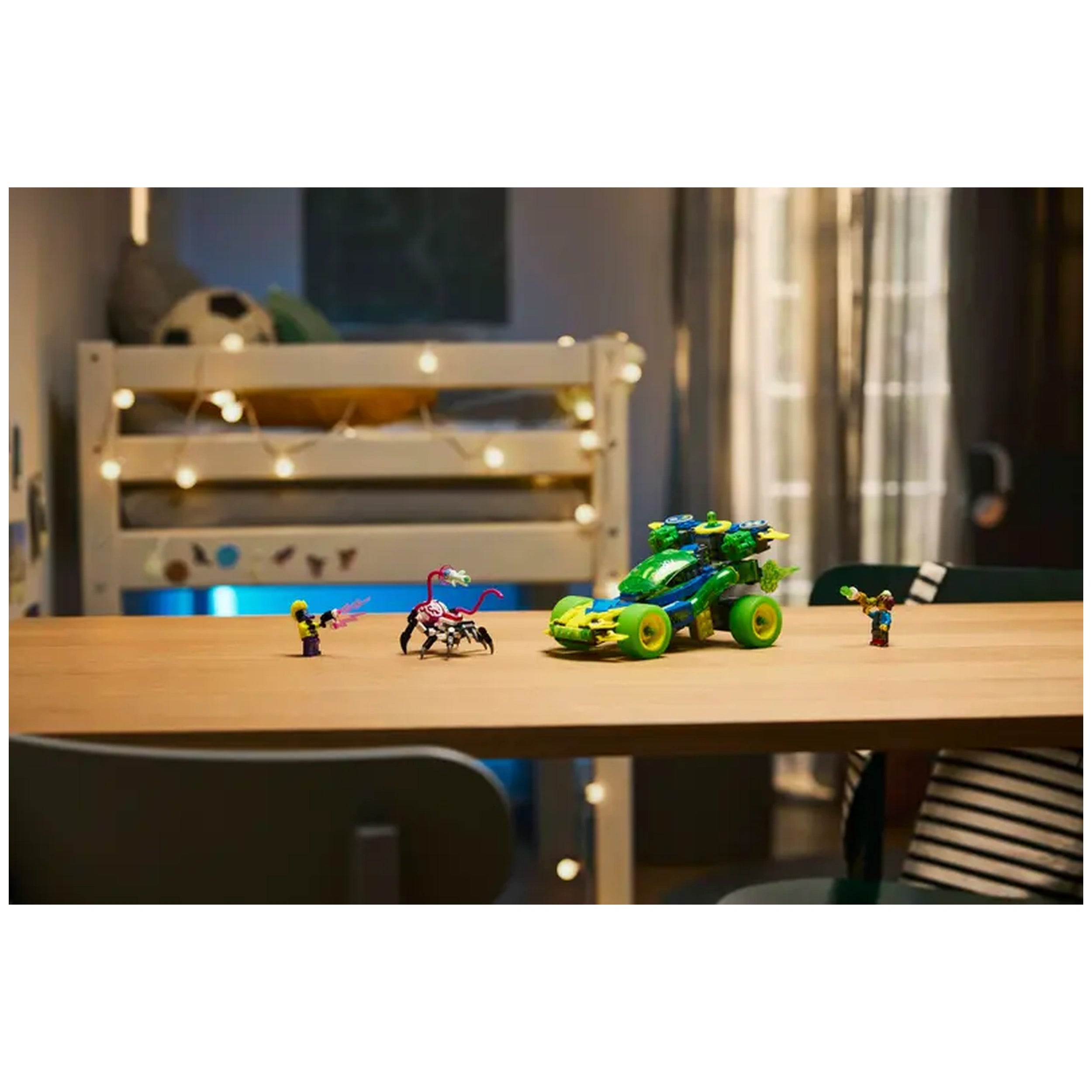 Colorful LEGO® DREAMZzz™ set featuring a green race car and various characters on a wooden table, with a cozy background and twinkling lights.