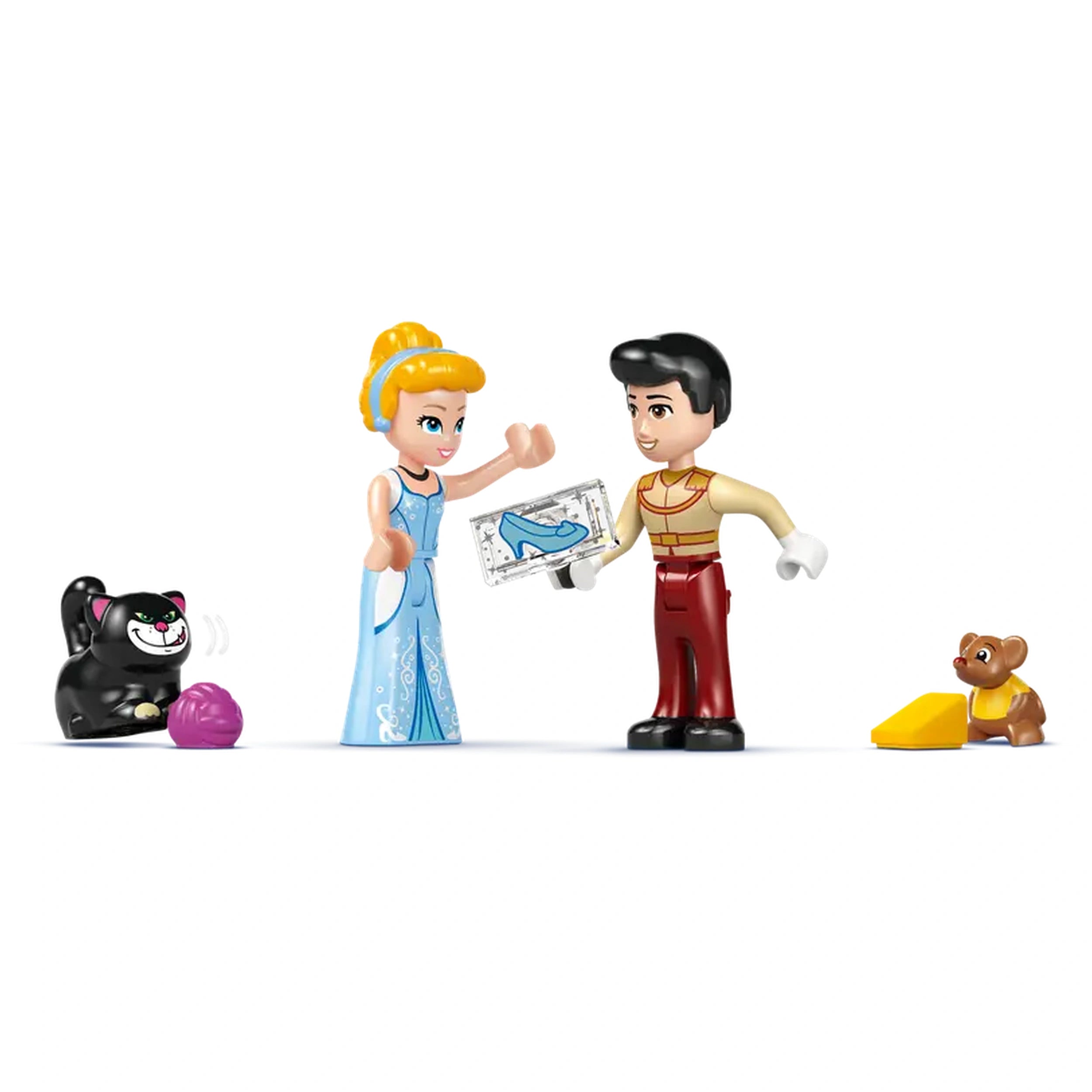 Cinderella in a blue dress shows a blueprint of a glass slipper to a prince, while a cat and a puppy watch playfully nearby.