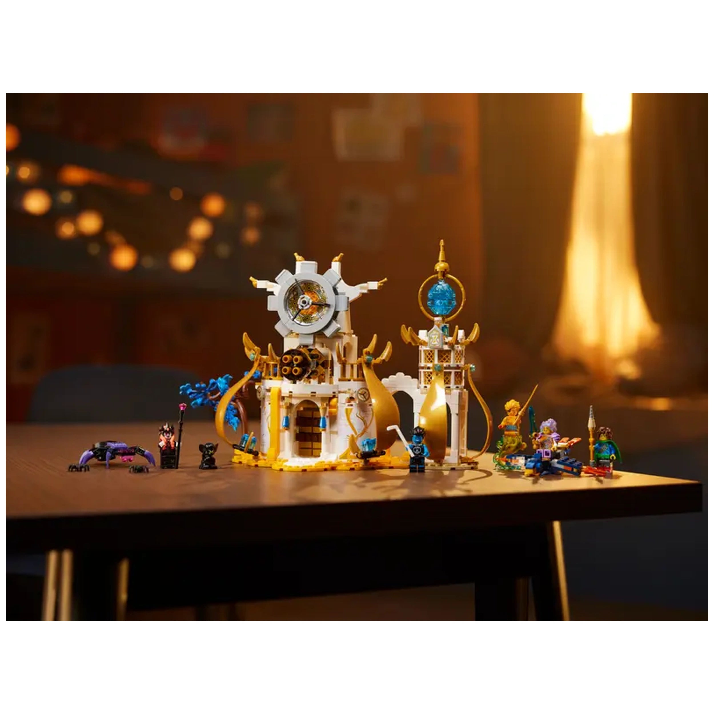 LEGO® DREAMZzz™ The Sandman's Tower set on a wooden table, featuring a white and gold castle, detailed characters, and accessories.