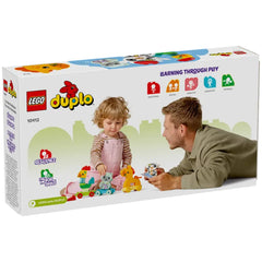 A young child and an adult interact playfully with the LEGO® DUPLO® My First Animal Train set, featuring colorful animal figures.