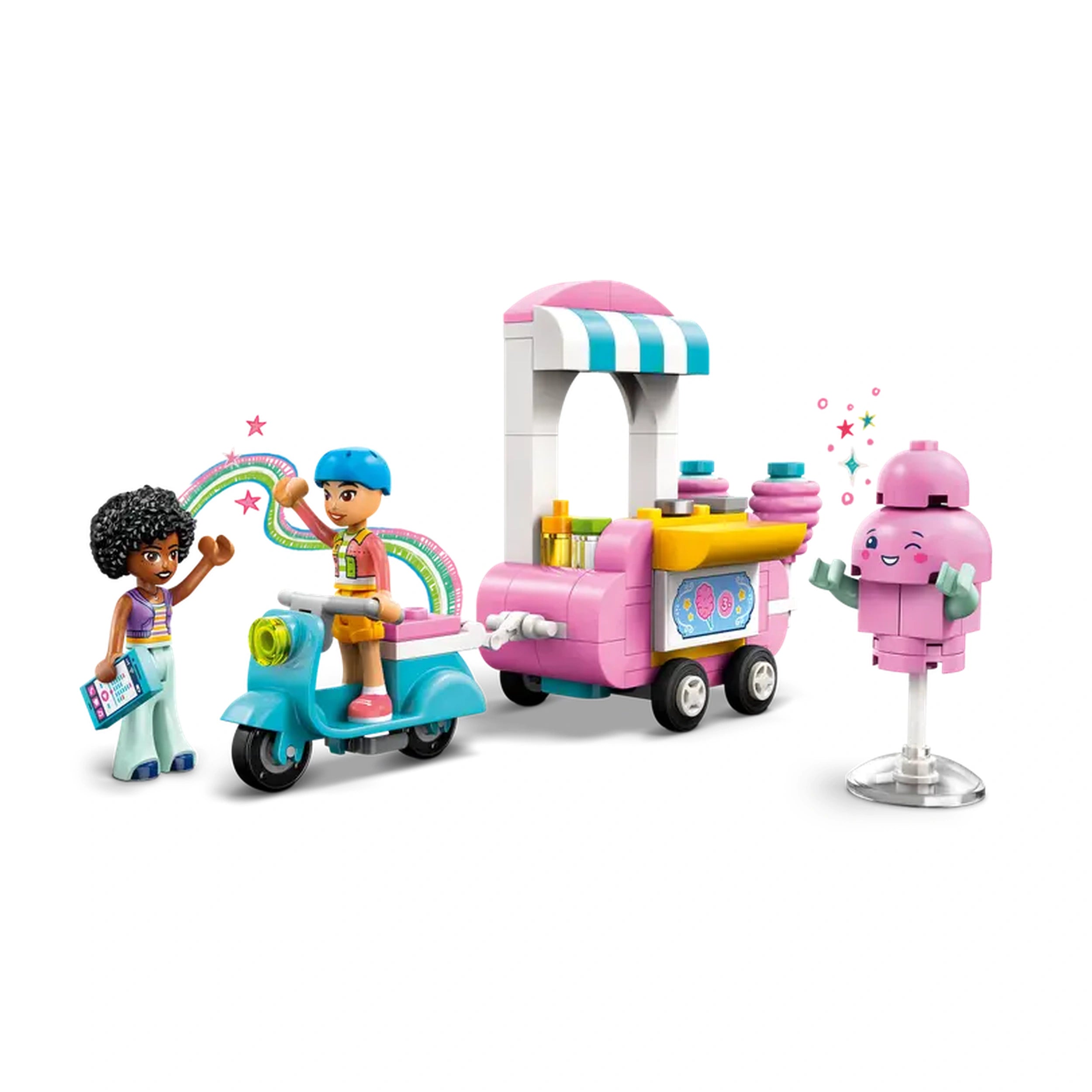 Two LEGO Friends minidolls, Liann and Jamila, stand beside a colorful cotton candy stand and scooter. Liann, with curly hair, waves excitedly, while Jamila, wearing a blue cap, rides the turquoise scooter. The pink food cart, featuring bright decorations and cotton candy accessories, adds a playful touch to the scene. A cute cotton candy figure smiles nearby, enhancing the fun atmosphere.