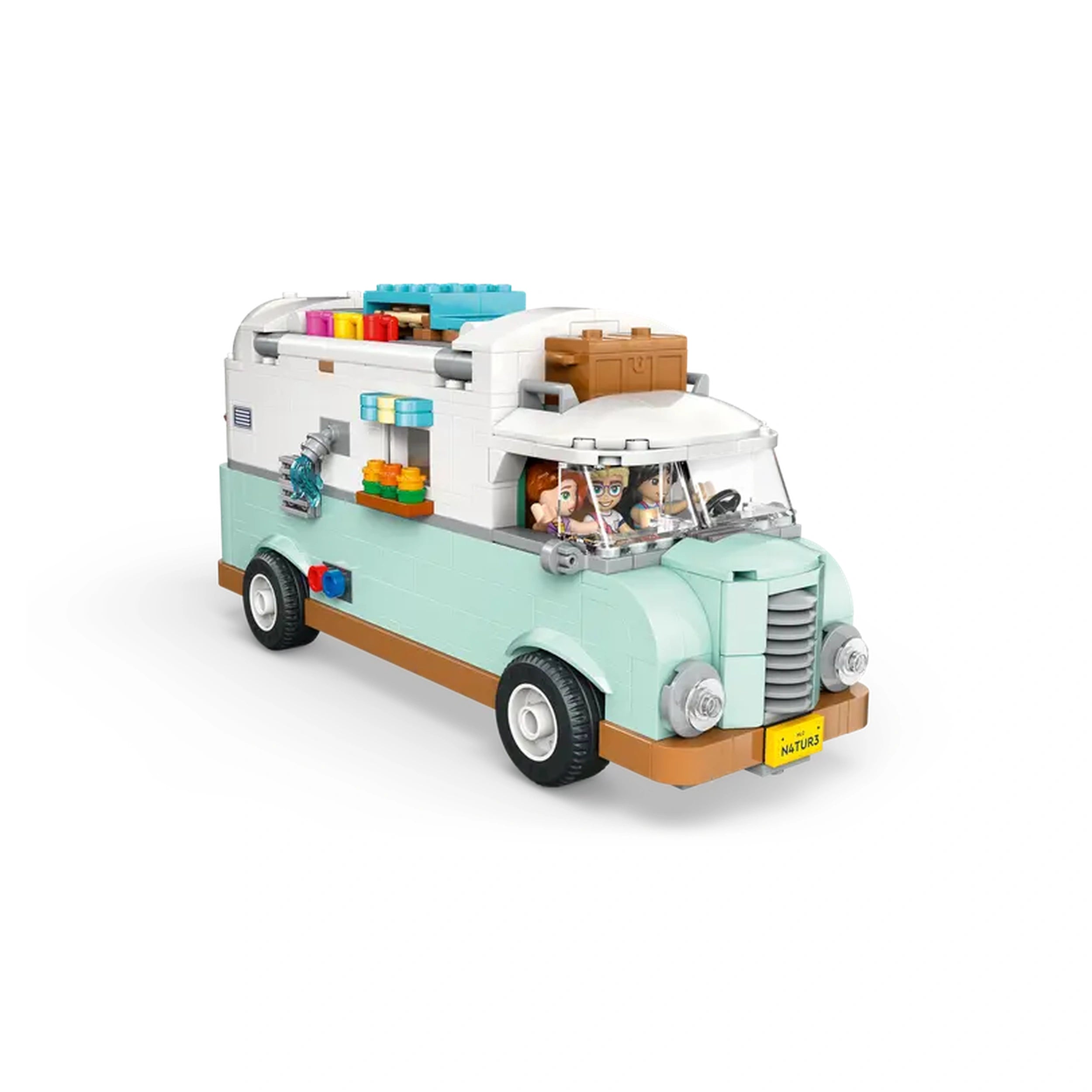 LEGO Friends Friendship Camper Van in light blue with orange accents, featuring two minidolls in the front seats and colorful accessories on the roof.
