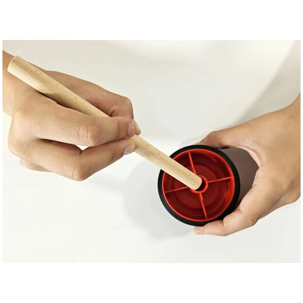 Hand assembling a colorful red wheel with a wooden axle, part of the Maly Constructor Junior 3X1 Buggy set.