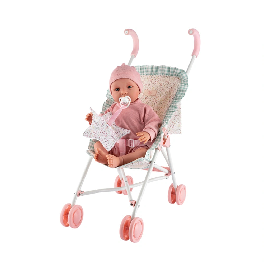 Doll in pink outfit sits in a white stroller with pink wheels and patterned fabric from the ASI Cloe Collection.
