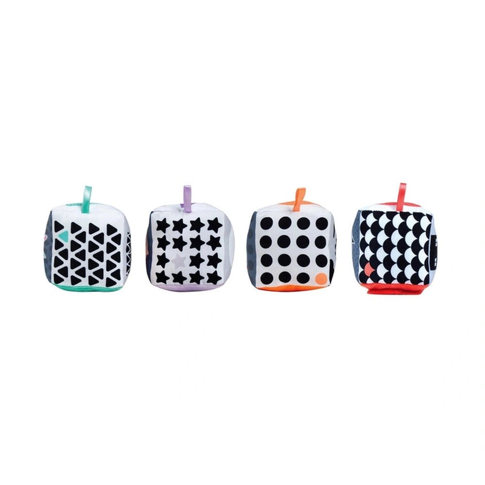 Black and white soft activity blocks with colorful loops for hanging, featuring various checkered patterns on a white backgro