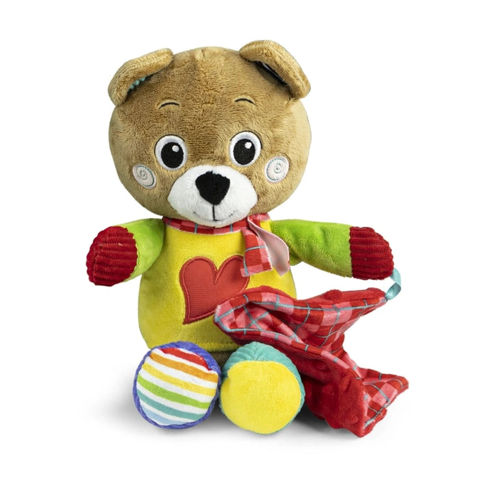 Bob the Bear is a plush teddy bear with a brown body, red heart, yellow shirt, and holding a plaid scarf and striped ball.