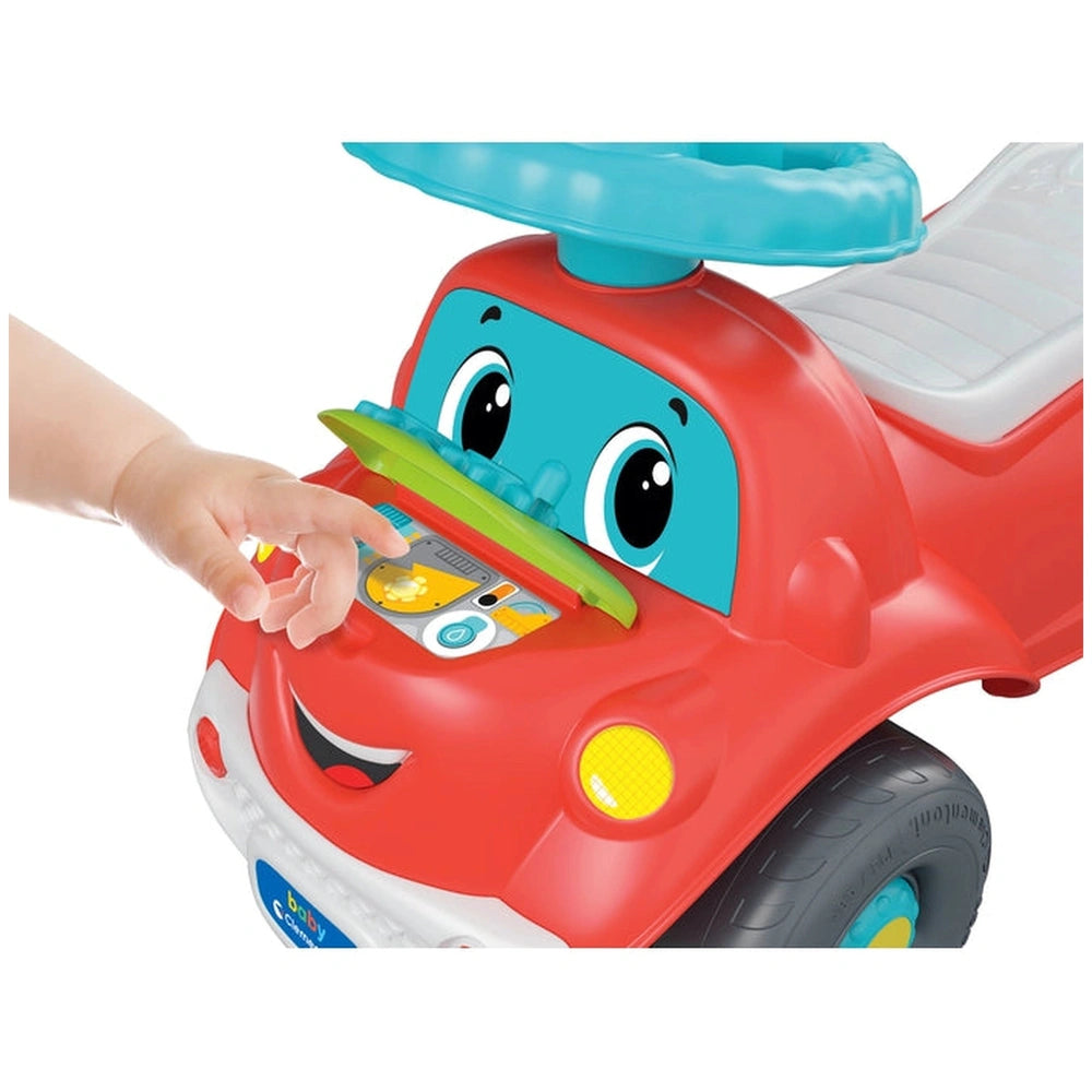 Baby Clementoni Nicolo Go Go toy car features a red body, blue roof, surfboard, and a green steering wheel with buttons.