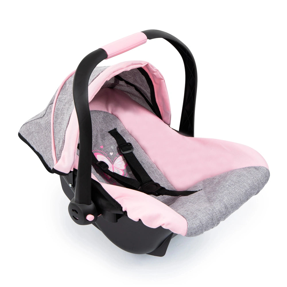 BAYER DESIGN Doll Deluxe Car Seat features a pink and gray patterned fabric cover, black frame, adjustable handle, and safety