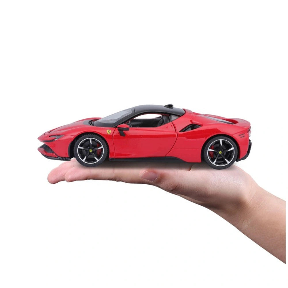 Ferrari SF90 Stradale 1:24 die-cast vehicle in red with black wheels and roof, centered in front view.