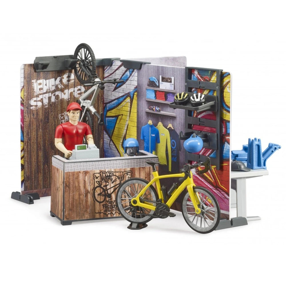 Toy bike shop playset with vibrant decor, yellow bike, shop counter, figure in red cap, helmets, and tools for repair fun.