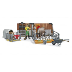 Farmer in barn set with cow, calf, wheelbarrow, and tools, showcasing farm life and animal care in Bruder toy set.