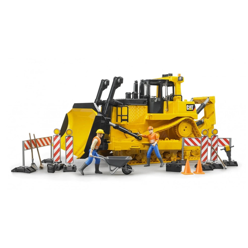 Toy Caterpillar bulldozer with construction figures and tools, featuring yellow and black details with safety barriers.