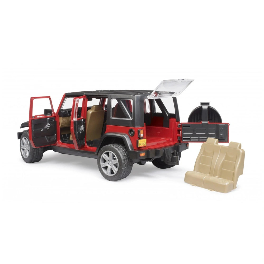 Red and black toy Jeep Wrangler with open doors and removable seats, showing rugged tires and back storage.