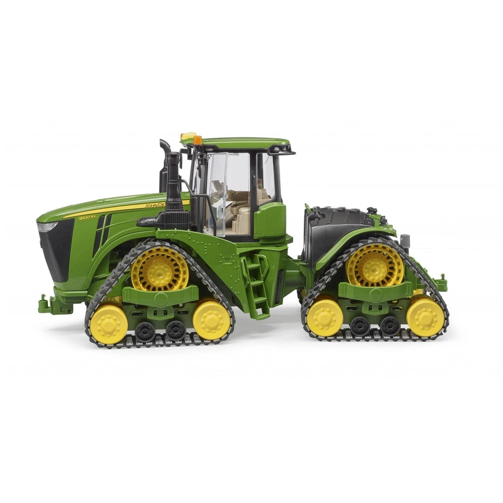 Bruder John Deere 9620Rx play vehicle with green body and yellow track belts, side view.