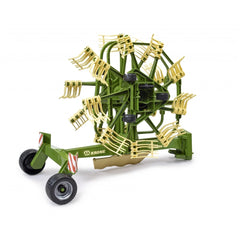 Green and yellow Bruder Krone dual rotary swath windrower toy with detailed spinning mechanism.