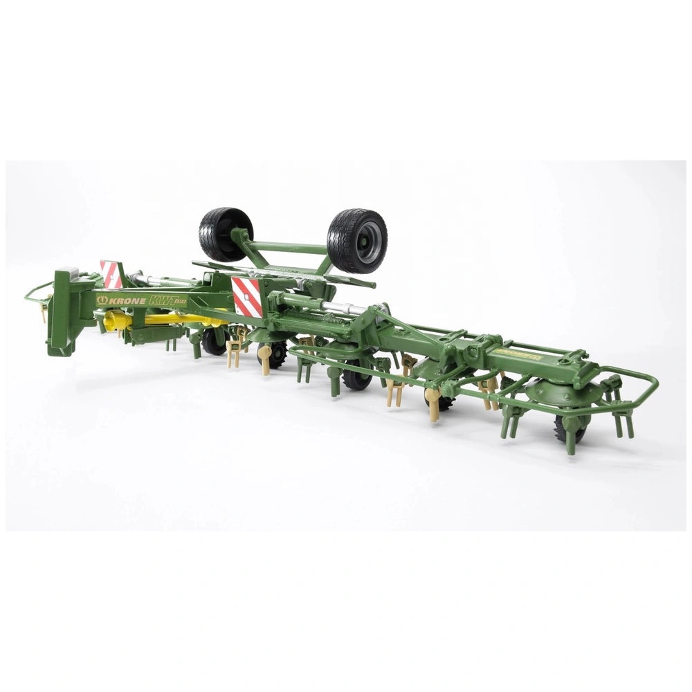 Bruder Krone Trailed Rotary Tedder toy, green with realistic agricultural features, against a white background.