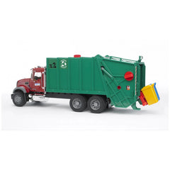 Red and green Bruder MACK Granite Garbage Truck toy with tilting yellow and blue trash containers.