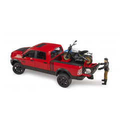 Red Bruder RAM 2500 Power Wagon toy with Ducati Desert Sled and figure loading bike onto the truck bed.