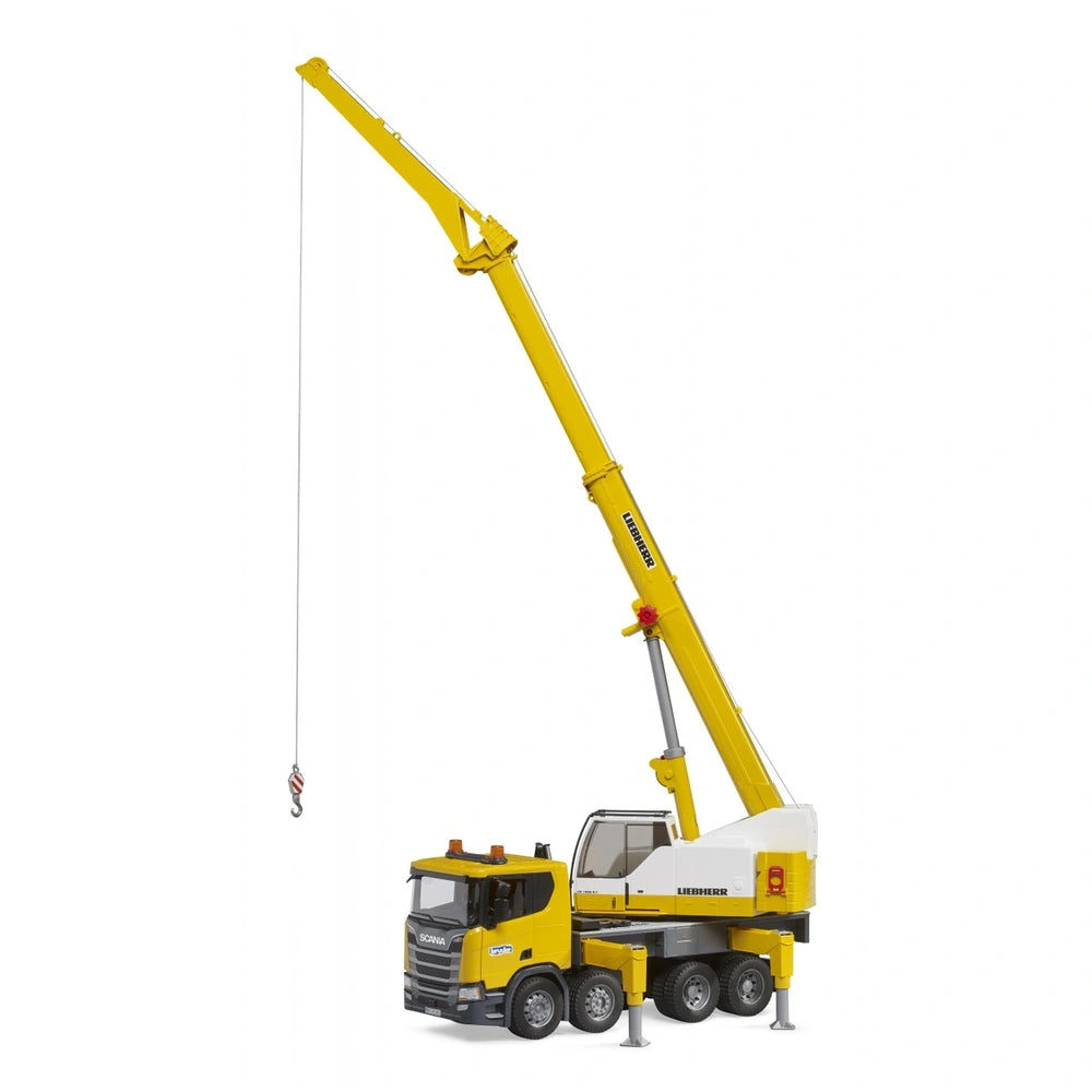 Yellow Scania Liebherr crane truck toy with extended telescopic arm and hook, on adjustable supports.