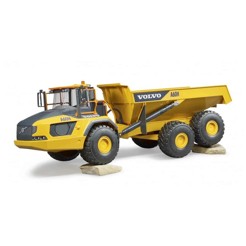 Yellow Bruder Volvo A60H hauler toy with articulated steering and large tires on display, mimicking a real construction vehicle.