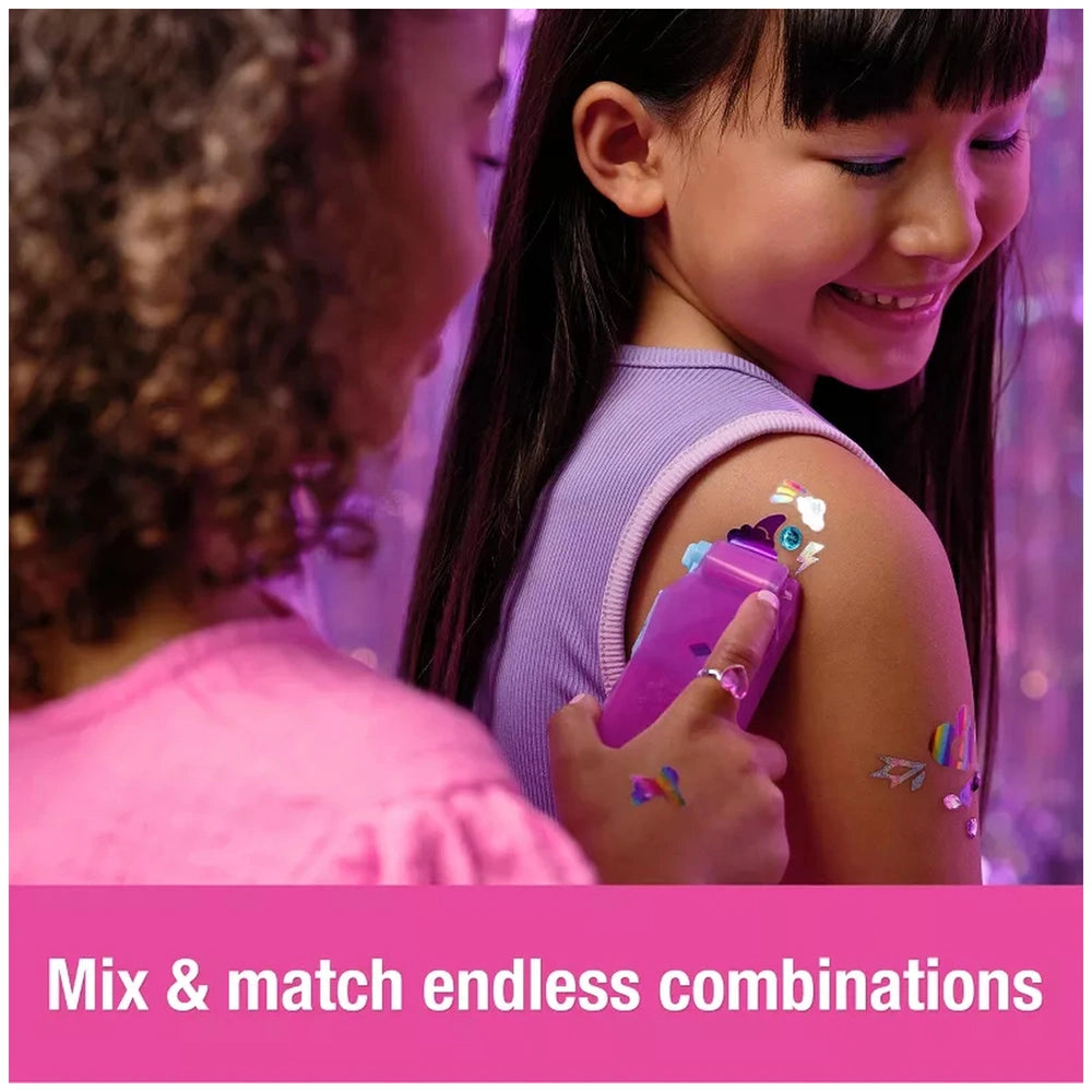 Cool Maker Shimmer Me Body Art Set is showcased with two girls applying colorful body art in a playful indoor setting.