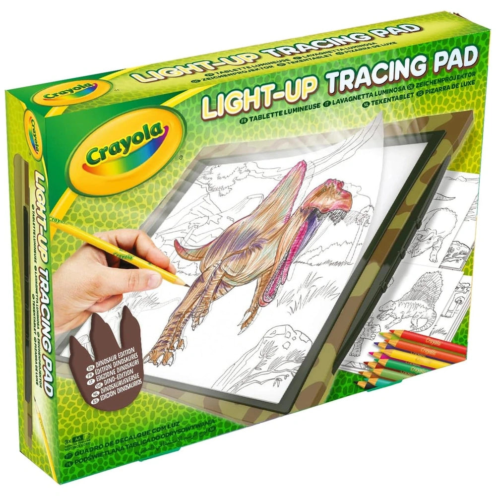 CRAYOLA Light-Up Tracing Pad packaging features a green design with a clear window, showcasing dinosaur-themed art supplies.