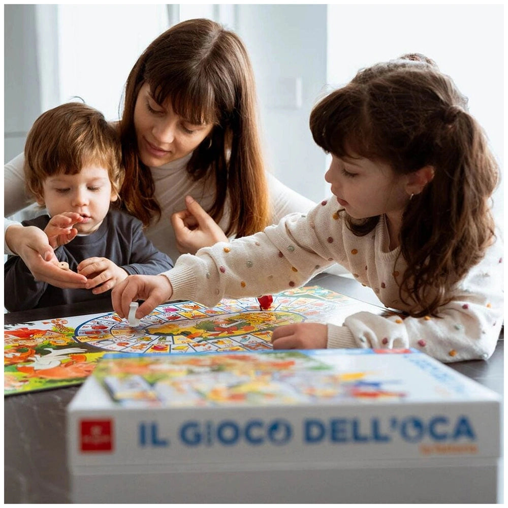 Dal Negro - The Goose Game - The Farm Board Games Set on a reflective table with a woman and two children in matching white s