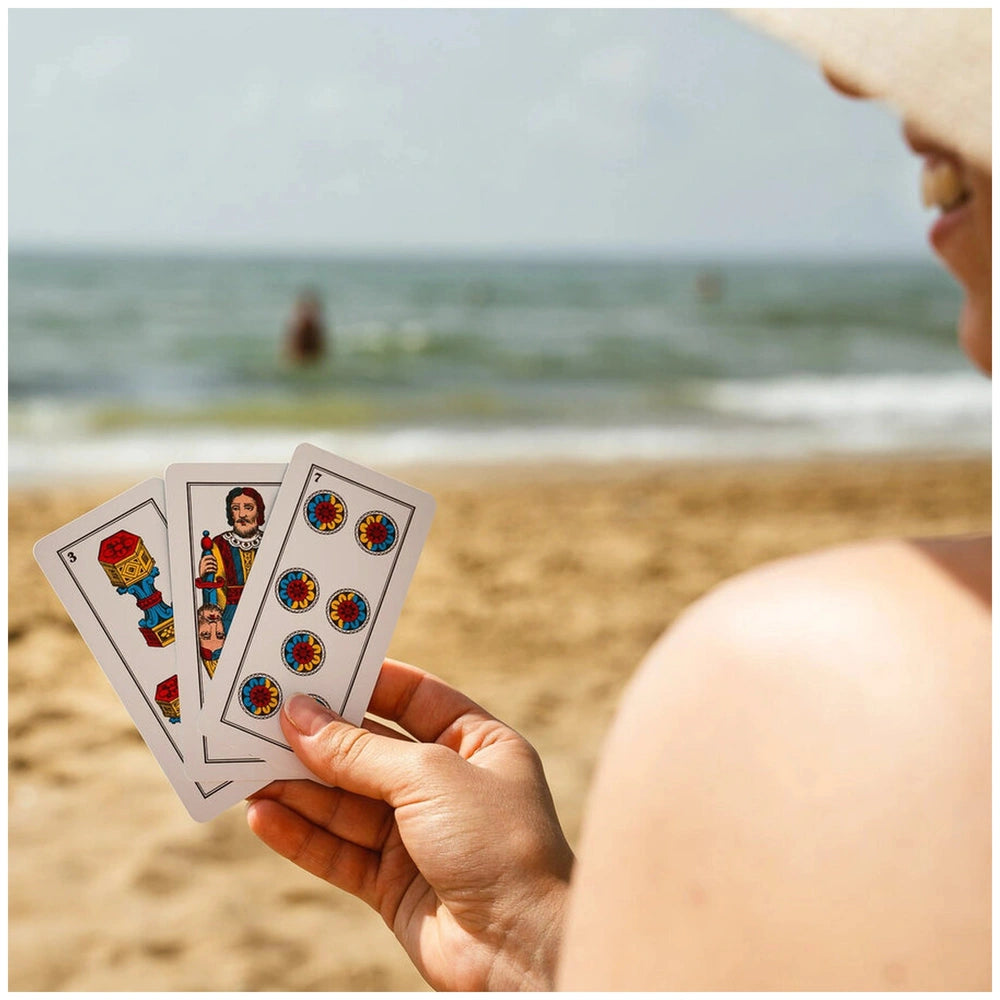 Dal Negro Trevisane Pro Cards N.114 displayed in hand at the beach, featuring colorful patterns and a visible number "7".