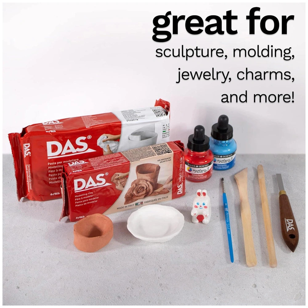 Das Modeling Clay - White 500 Gr. in red packaging with printed details and various tools including paintbrushes and bowls.